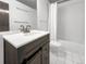 Bathroom featuring a vanity and a shower-tub combo at 480 S Marion Pkwy # 1202, Denver, CO 80209