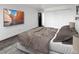 Bedroom featuring plush carpeting, a large window, and a spacious closet at 480 S Marion Pkwy # 1202, Denver, CO 80209
