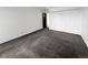 An empty bedroom featuring plush carpeting and a spacious closet at 480 S Marion Pkwy # 1202, Denver, CO 80209