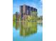 Exterior lake view of a building reflected in the water at 480 S Marion Pkwy # 1202, Denver, CO 80209