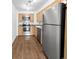 Efficient kitchen features stainless steel appliances, light wood cabinets, and hardwood floors at 480 S Marion Pkwy # 1202, Denver, CO 80209