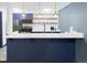 This kitchen features white countertops, modern appliances, and stylish pendant lighting at 480 S Marion Pkwy # 1202, Denver, CO 80209