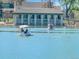 Scenic lake view with paddle boats and a charming boathouse, creating a serene atmosphere at 480 S Marion Pkwy # 1202, Denver, CO 80209