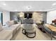 Modern Living Room with wood accent wall, TV, and couches at 480 S Marion Pkwy # 1202, Denver, CO 80209