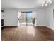 Bright living room with hardwood floors, balcony access, and lots of natural light at 480 S Marion Pkwy # 1202, Denver, CO 80209