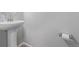 A half bathroom featuring a pedestal sink, tiled flooring, and light gray wall paint at 18112 E 104Th Way, Commerce City, CO 80022