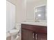 A full bathroom with a shower-tub combo, vanity with a white top, and a mirrored medicine cabinet at 18112 E 104Th Way, Commerce City, CO 80022