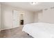 The main bedroom showcases a neutral color palette with an ensuite bathroom, a walk-in closet and carpeted floors at 18112 E 104Th Way, Commerce City, CO 80022
