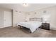 A primary bedroom with neutral tones, and contemporary bedside tables and lighting at 18112 E 104Th Way, Commerce City, CO 80022