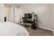 A bedroom including an office space with a desk, shelves, and computer at 18112 E 104Th Way, Commerce City, CO 80022