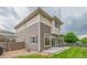 Exterior view of the multi-level home highlighting the architectural design and outdoor spaces with sliding glass doors at 18112 E 104Th Way, Commerce City, CO 80022