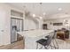 Open-concept kitchen with a large island, stainless steel appliances, and modern finishes at 18112 E 104Th Way, Commerce City, CO 80022