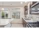 Modern kitchen with stainless steel appliances, granite countertops, and a view to the outside at 18112 E 104Th Way, Commerce City, CO 80022