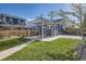 Spacious backyard features a covered patio, lush lawn, and mature landscaping, great for outdoor enjoyment at 4441 N Meade St, Denver, CO 80211