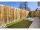 Fenced backyard with artificial turf and outdoor seating area at 4441 N Meade St, Denver, CO 80211