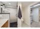 This bathroom features a modern glass shower, white subway tile, and a hexagon-tiled floor with built-in storage at 4441 N Meade St, Denver, CO 80211