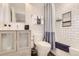 Clean bathroom with white subway tile, modern vanity, and stylish shower curtain at 4441 N Meade St, Denver, CO 80211