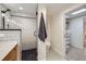 This is a bright bathroom, showing off the shower, toilet and view into a custom closet at 4441 N Meade St, Denver, CO 80211