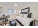 Cozy bedroom with a daybed, windows, and a stylish desk area, perfect for relaxation and work at 4441 N Meade St, Denver, CO 80211