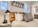 The primary bedroom features soft lighting, wall art and an ensuite bathroom at 4441 N Meade St, Denver, CO 80211