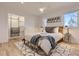 This primary bedroom includes a ceiling fan, natural light and a closet at 4441 N Meade St, Denver, CO 80211