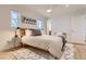 Bright bedroom featuring hardwood floors, a ceiling fan, and a contemporary design at 4441 N Meade St, Denver, CO 80211