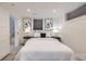 Basement bedroom featuring stylish lamps and neutral paint at 4441 N Meade St, Denver, CO 80211