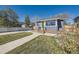 Charming home with well-maintained lawn, brick accents, and a welcoming front porch at 4441 N Meade St, Denver, CO 80211