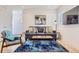 Inviting living room with a comfortable sofa, decorative rug, and minimalist decor for a cozy and stylish space at 4441 N Meade St, Denver, CO 80211