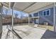 Covered patio with concrete flooring, white pillars, and view of the backyard at 4441 N Meade St, Denver, CO 80211