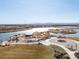 Aerial view of the community park and lake in a Primary-planned neighborhood at 5072 Lake Port Ave, Firestone, CO 80504