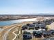 Community aerial view showcasing homes nestled among lakes, and well maintained roads at 5072 Lake Port Ave, Firestone, CO 80504