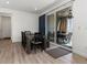 Modern dining area with a dark wood table and chairs, plus sliding door to a patio at 5072 Lake Port Ave, Firestone, CO 80504