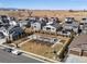 An aerial view of a neighborhood with solar panels and a community playground at 5072 Lake Port Ave, Firestone, CO 80504