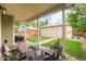 Cozy backyard featuring a back porch, a garage, and a grassy area at 3864 Osceola St, Denver, CO 80212