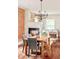 Well-lit dining room showcasing hardwood floors, fireplace, and comfortable seating at 3864 Osceola St, Denver, CO 80212