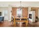 Elegant dining room featuring a fireplace, stylish table setting, and natural light at 3864 Osceola St, Denver, CO 80212