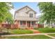 Charming two-story home with a welcoming front porch and well-maintained lawn at 3864 Osceola St, Denver, CO 80212