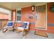 Inviting front porch featuring cozy rocking chairs, perfect for relaxing outdoors at 3864 Osceola St, Denver, CO 80212