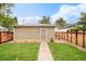 View of the garage from the backyard showcasing its neutral color scheme and landscaping at 3864 Osceola St, Denver, CO 80212