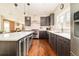 Modern kitchen has stainless appliances, stone counter tops, and a large kitchen island at 3864 Osceola St, Denver, CO 80212