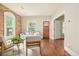 Cozy living room with hardwood floors, exposed brick, and abundant natural light at 3864 Osceola St, Denver, CO 80212
