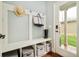 Mud room with ample storage cubbies, hooks, and a door to the outside at 3864 Osceola St, Denver, CO 80212
