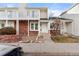Brick townhouse exterior with small front yard and walkway at 17286 E Ford Dr, Aurora, CO 80017