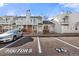 Front view of townhome with parking area at 17286 E Ford Dr, Aurora, CO 80017