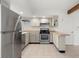 Kitchen features stainless steel appliances and wood countertops at 17286 E Ford Dr, Aurora, CO 80017
