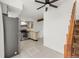 Updated kitchen features stainless steel appliances and tile floors at 17286 E Ford Dr, Aurora, CO 80017