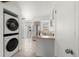 Stackable washer and dryer in a laundry closet at 17286 E Ford Dr, Aurora, CO 80017