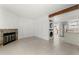 Living room with fireplace, tile floors and kitchen view at 17286 E Ford Dr, Aurora, CO 80017