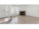 Living area with fireplace, tiled floors, and entryway at 17286 E Ford Dr, Aurora, CO 80017